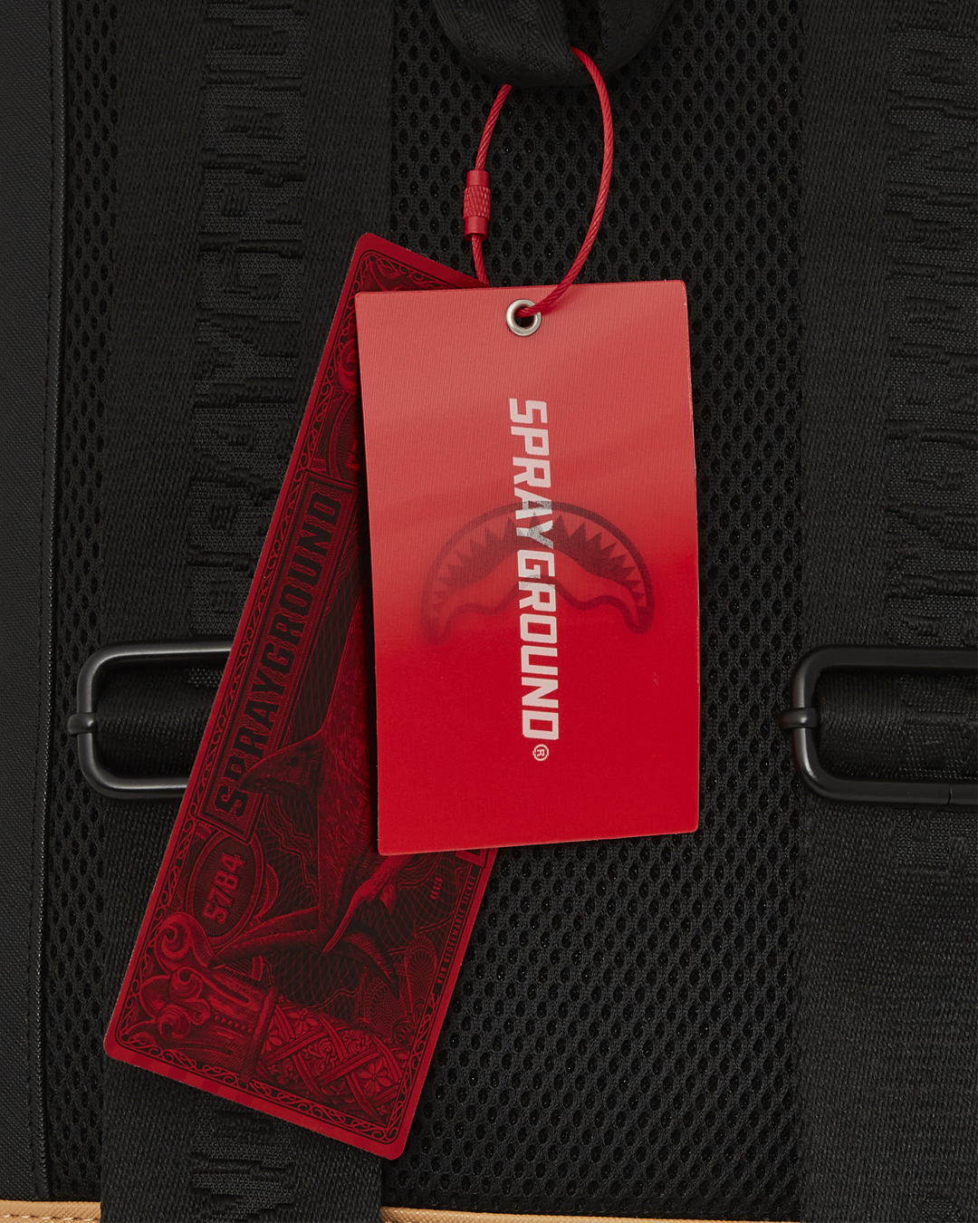Ergonomic mesh back padding and whip stitch detailing on a faux leather backpack.