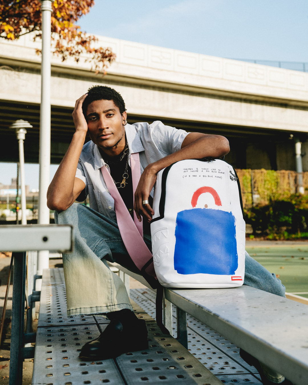 Interior of faux leather art backpack showing laptop compartment and organization pockets