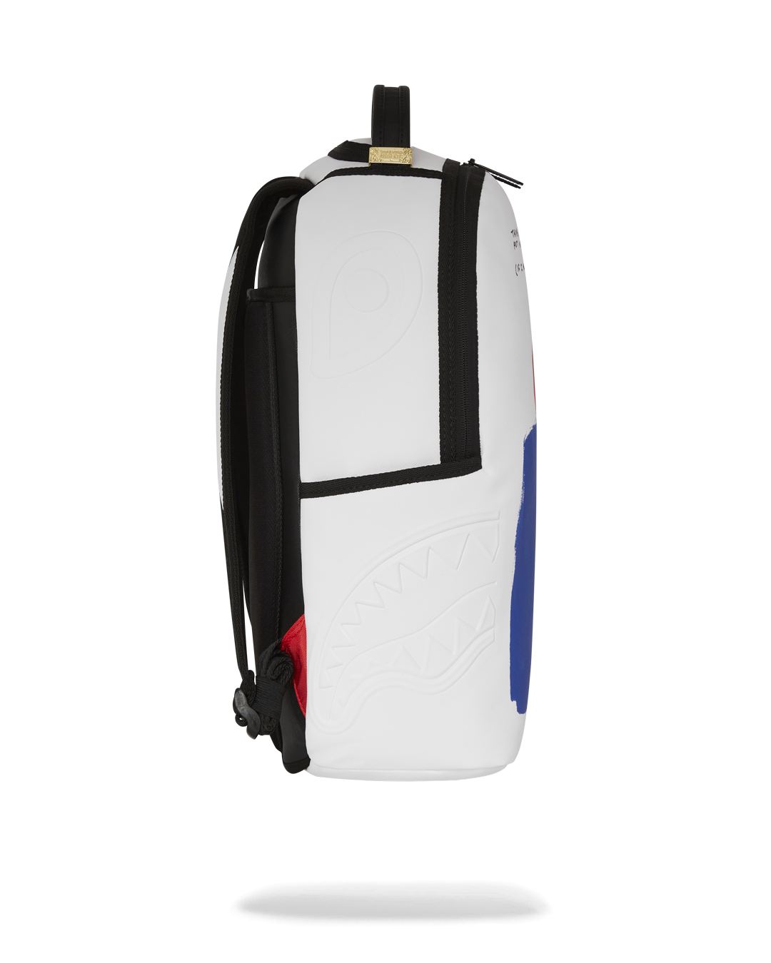 Interior of faux leather art backpack showing laptop compartment and organization pockets