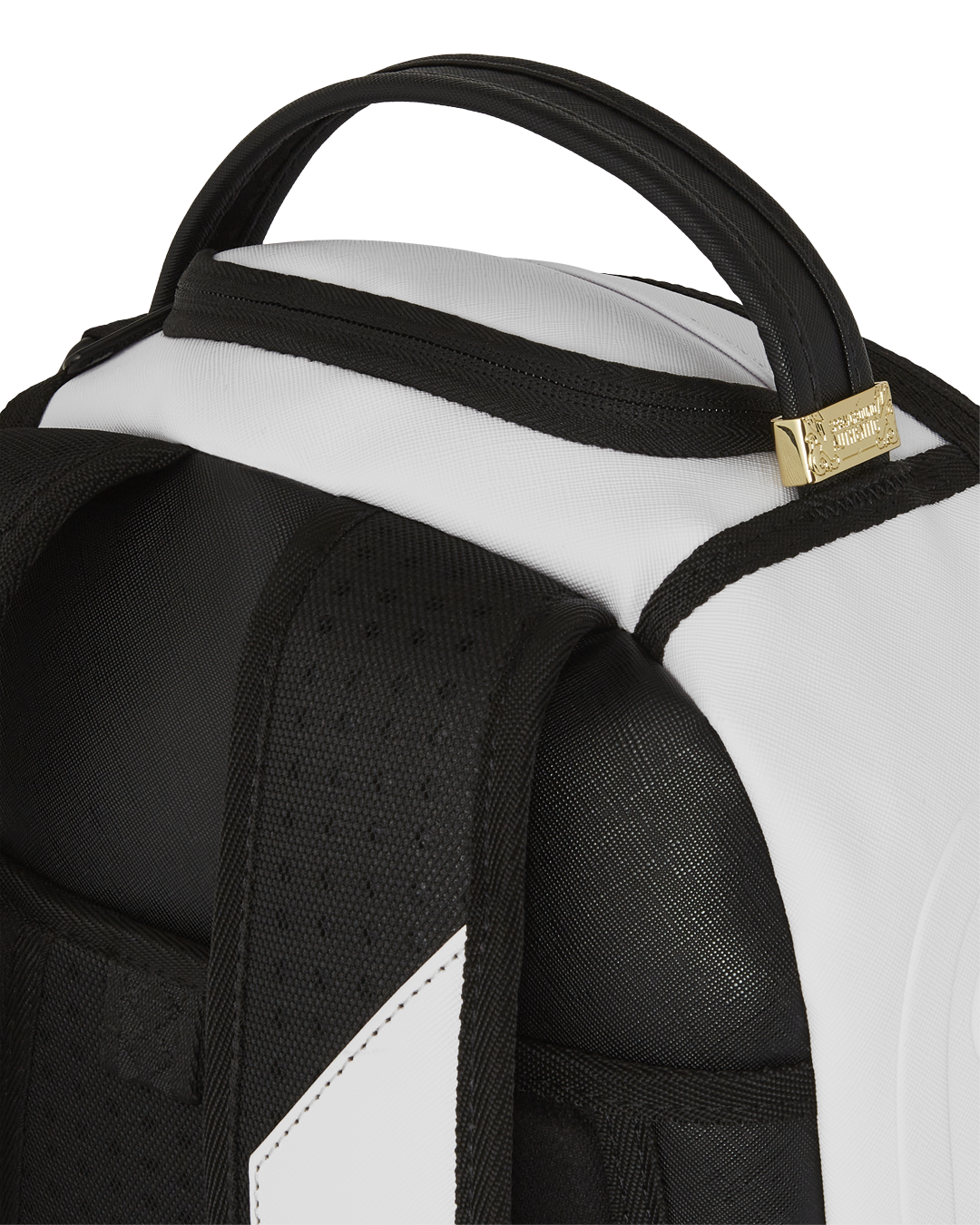 Interior of faux leather art backpack showing laptop compartment and organization pockets