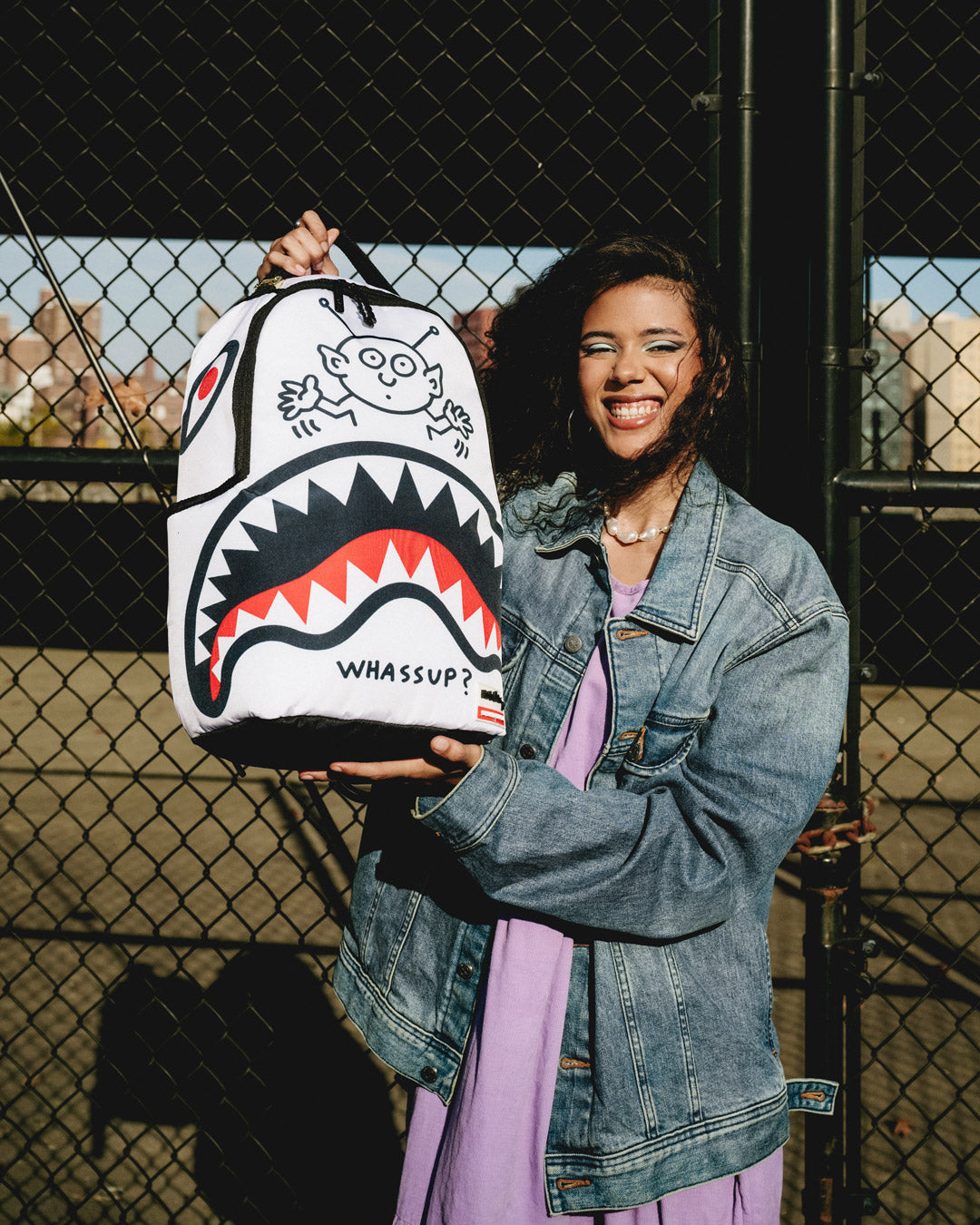 Open interior view of the clear Sprayground backpack featuring velour laptop sleeve and organizer pockets