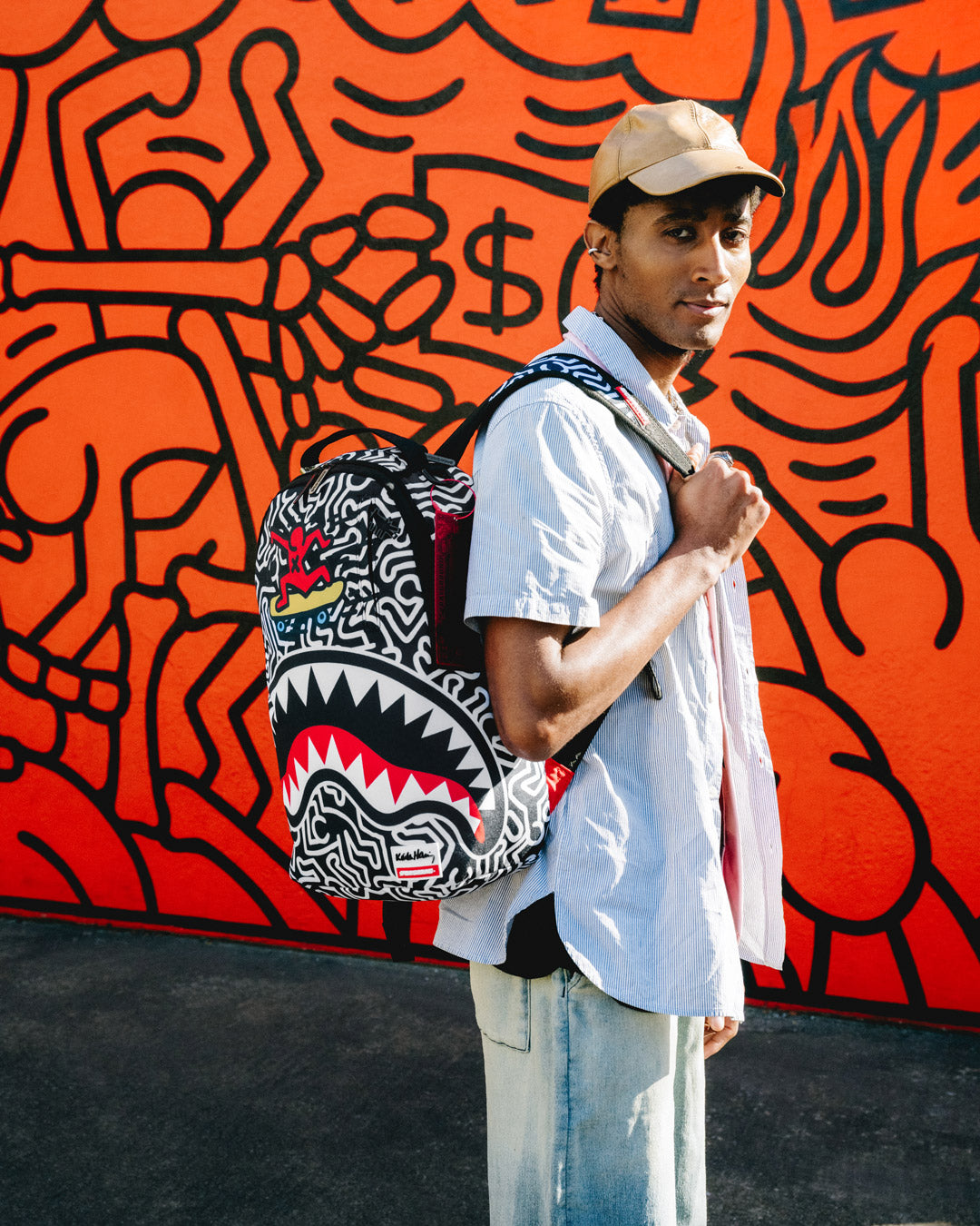 Side view of the roller skate backpack with side pockets and ergonomic back padding.