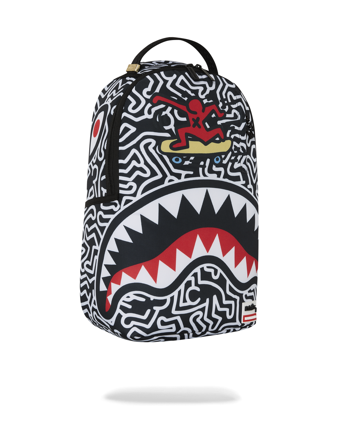 Close-up of the zipper and metal hardware on the Keith Haring backpack.