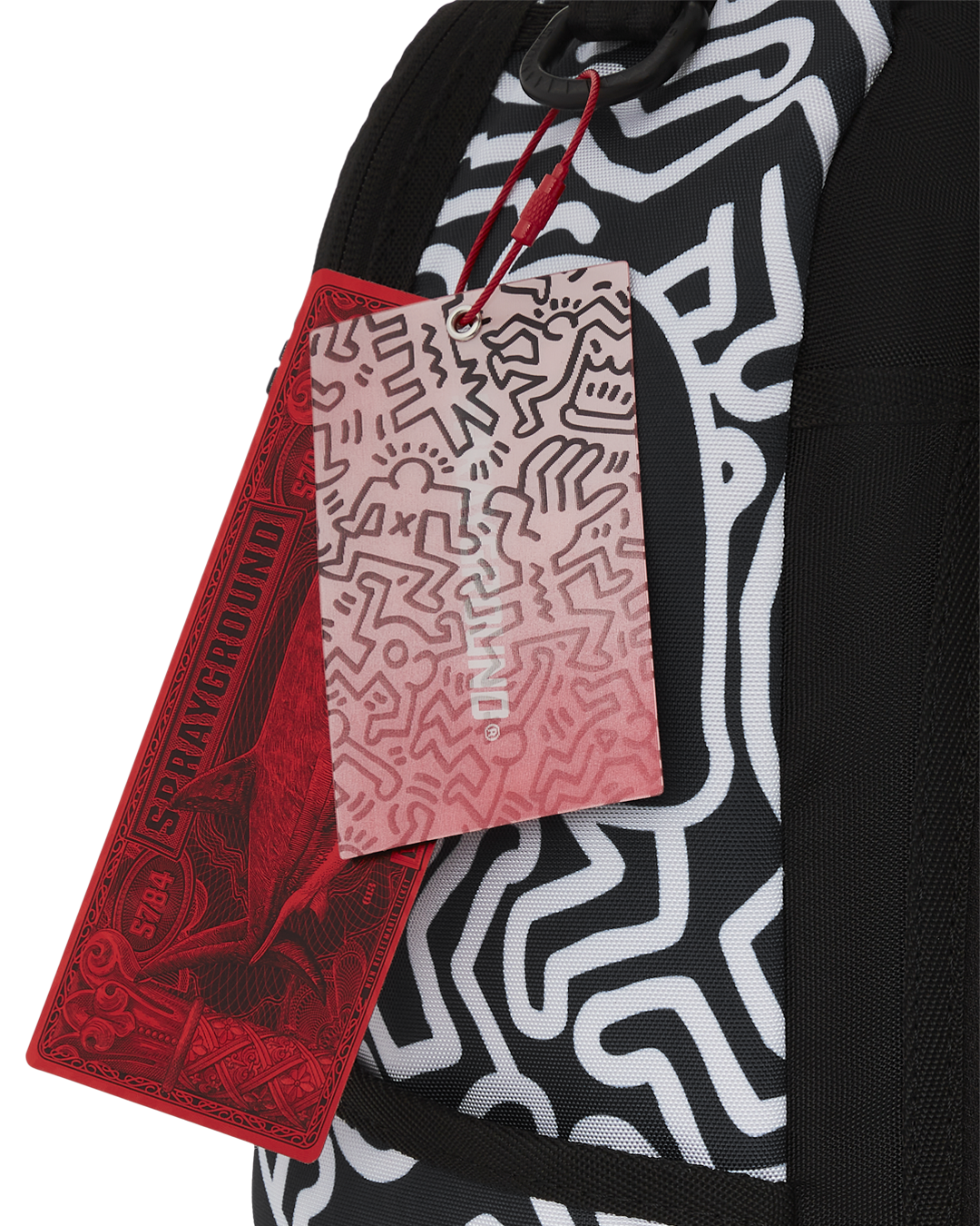 Front view of the Keith Haring shark design skater backpack showcasing the vibrant artwork.