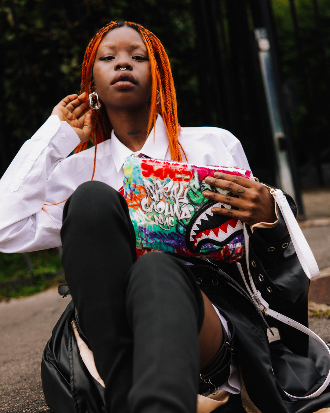 Interior pocket of the graffiti clutch showing space for essentials.