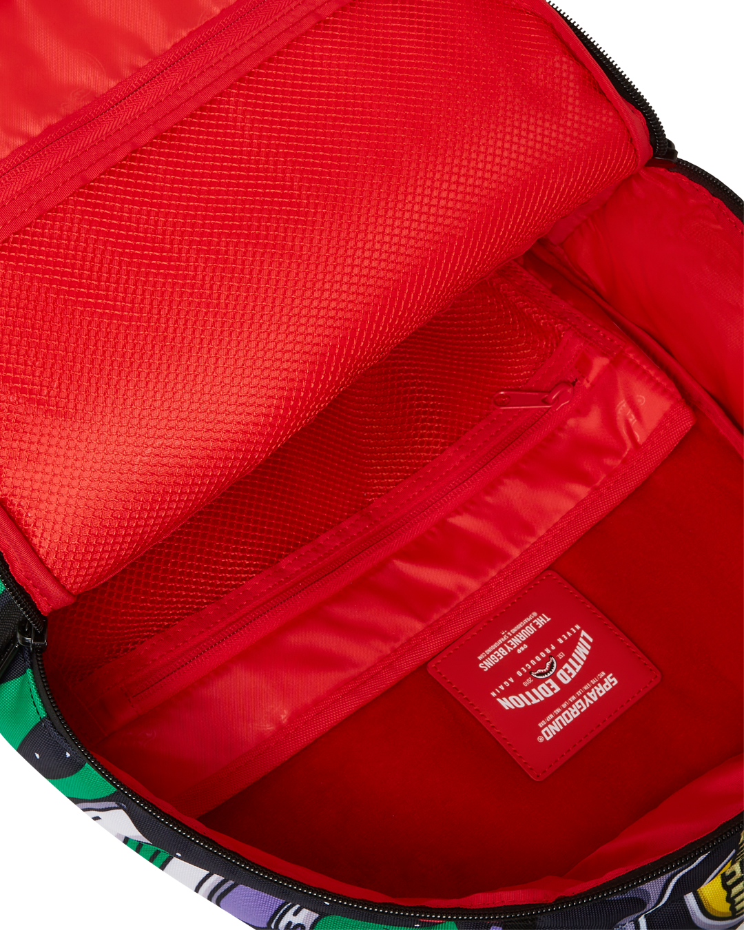 Sprayground Shark Backpack worn by a woman, demonstrating its adjustable straps and side pockets.