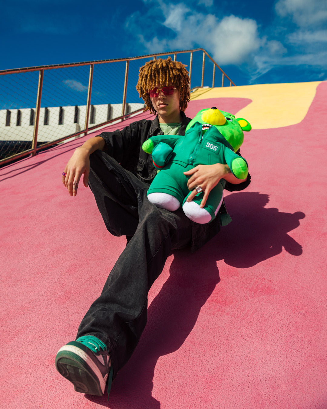 Side view showcasing adjustable straps on the teddy bear backpack.