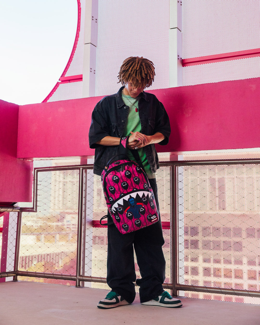 Side profile of the backpack displaying side pockets and adjustable straps