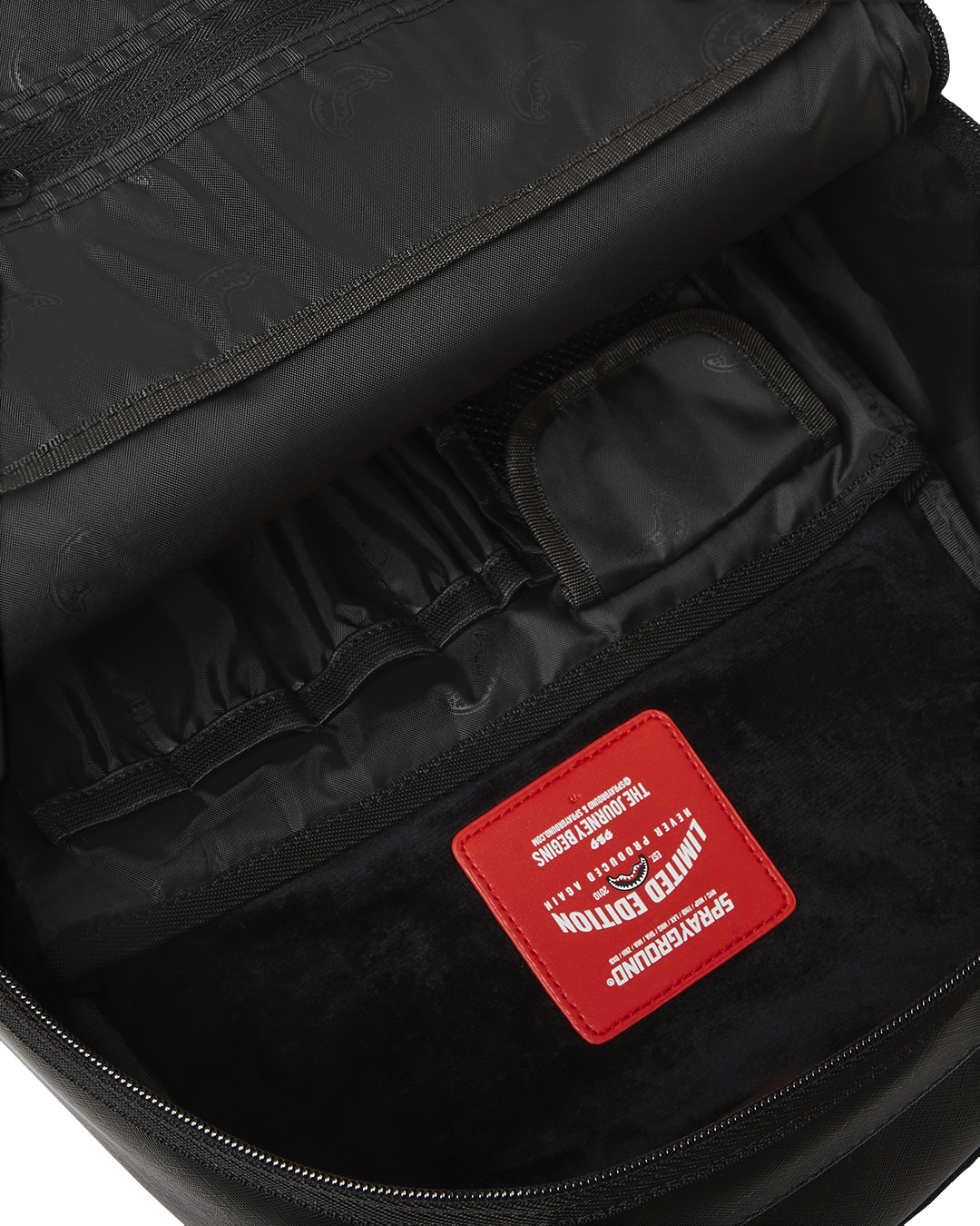 Side profile of the pink Sprayground backpack highlighting its ergonomic features.
