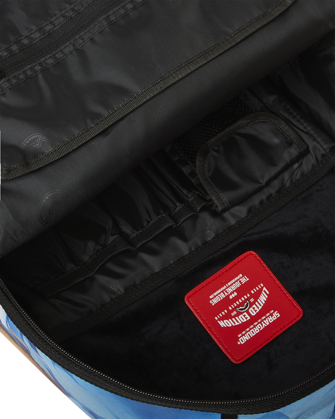 Side angle of the backpack highlighting the ergonomic mesh back padding and adjustable straps.