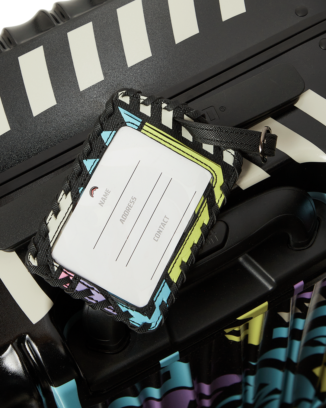 Close-up of TSA lock and telescoping handle on durable hardshell suitcase