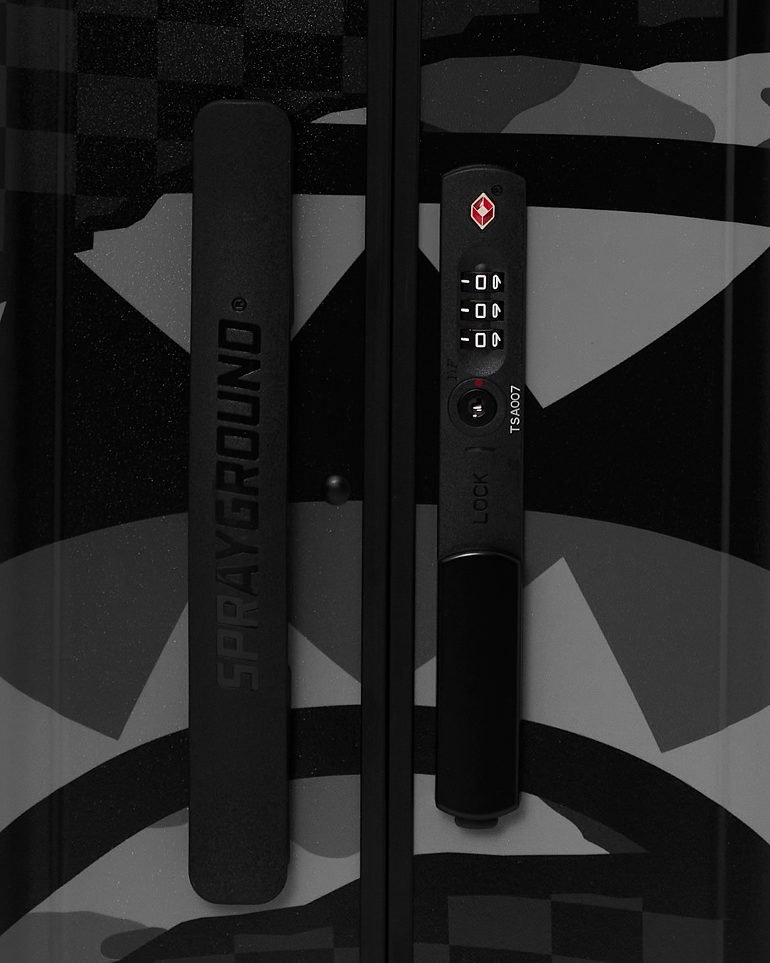 Close-up of the double spinner wheels and telescopic handle for easy navigation.