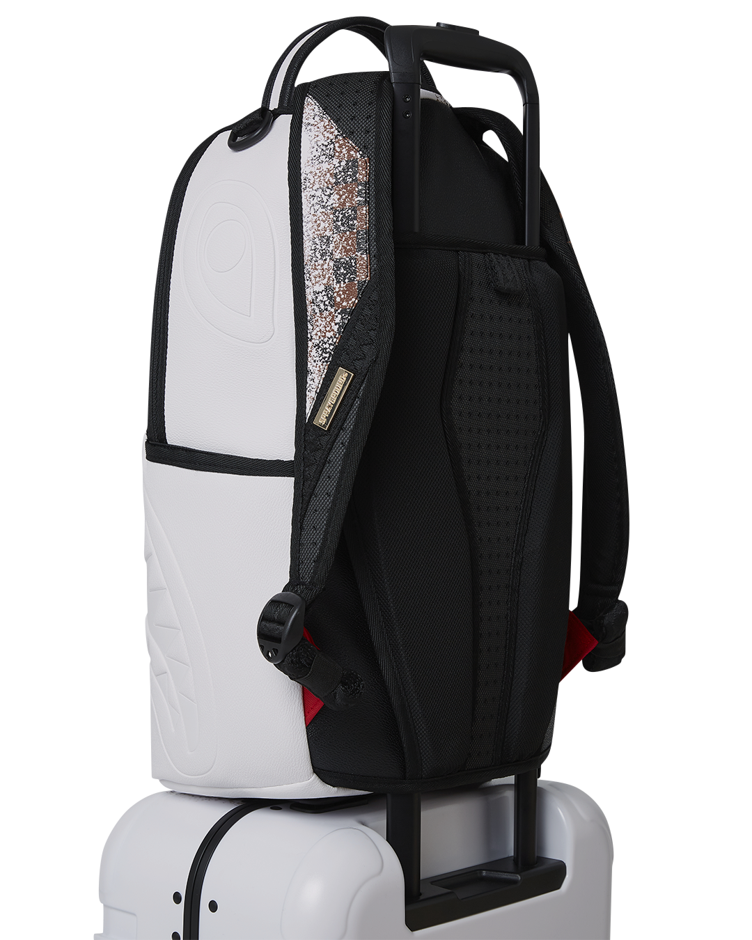 Sharkitecture luggage interior with mesh organizer pockets and fastening straps