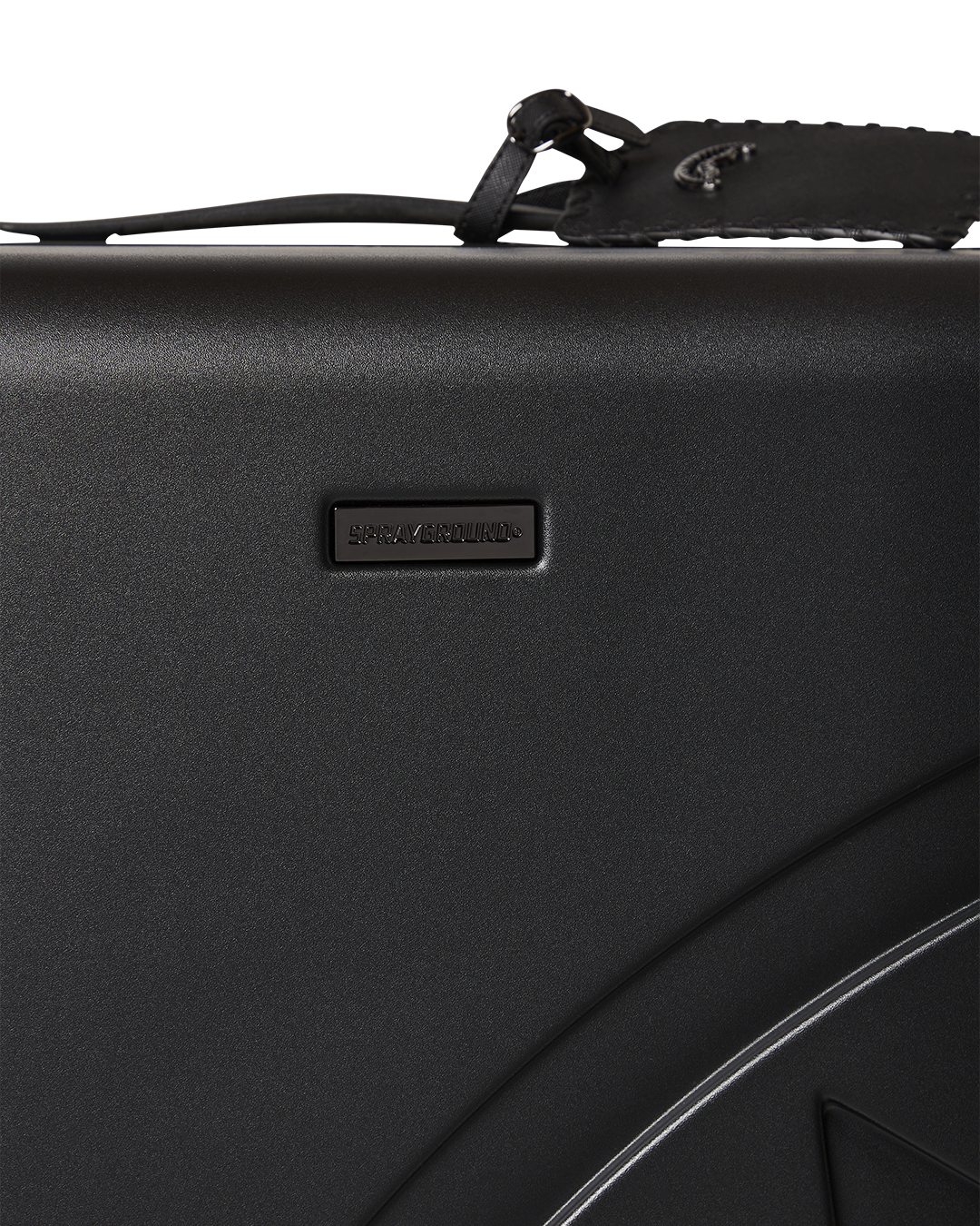 Close-up of the polycarbonate exterior with shark sculpture design on JetBlack luggage