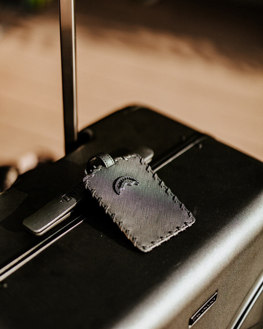 Close-up of the polycarbonate exterior with shark sculpture design on JetBlack luggage