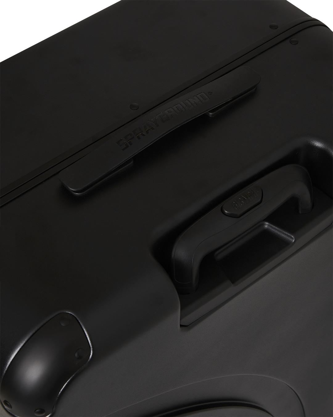 Luggage with spinner wheels and telescoping handle on airport terminal floor