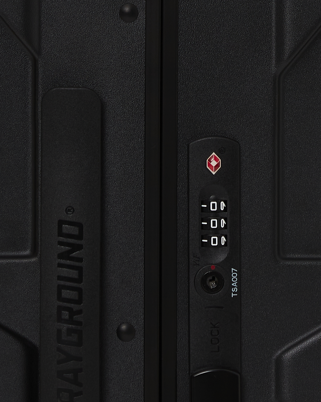 Close-up of JetBlack hardshell luggage wheels, highlighting the smooth spinner action.