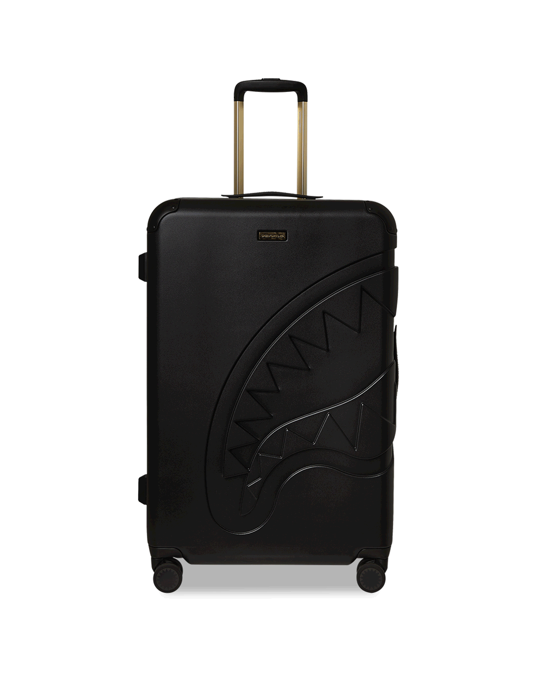 Close-up of JetBlack luggage with gold hardware and double spinner wheels.