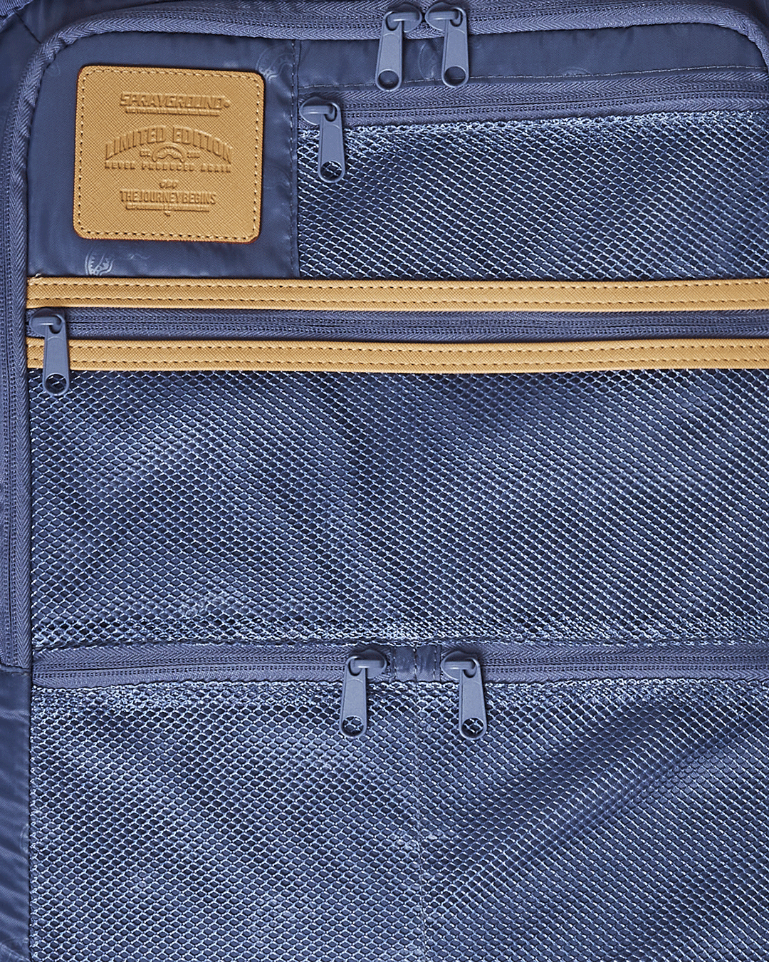Side view of the faux leather luggage highlighting the telescoping handle and embossed logo