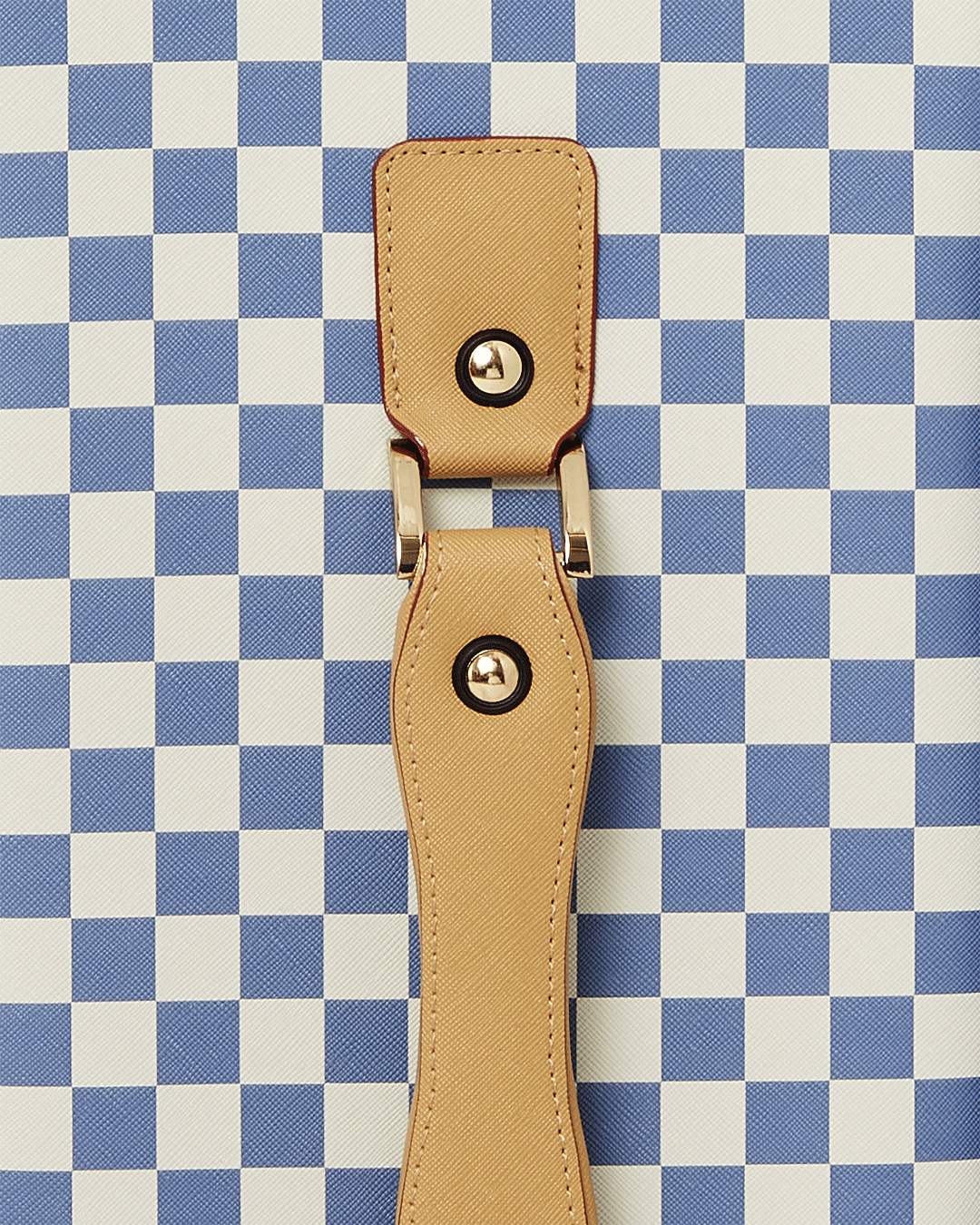 Side view of the faux leather luggage highlighting the telescoping handle and embossed logo