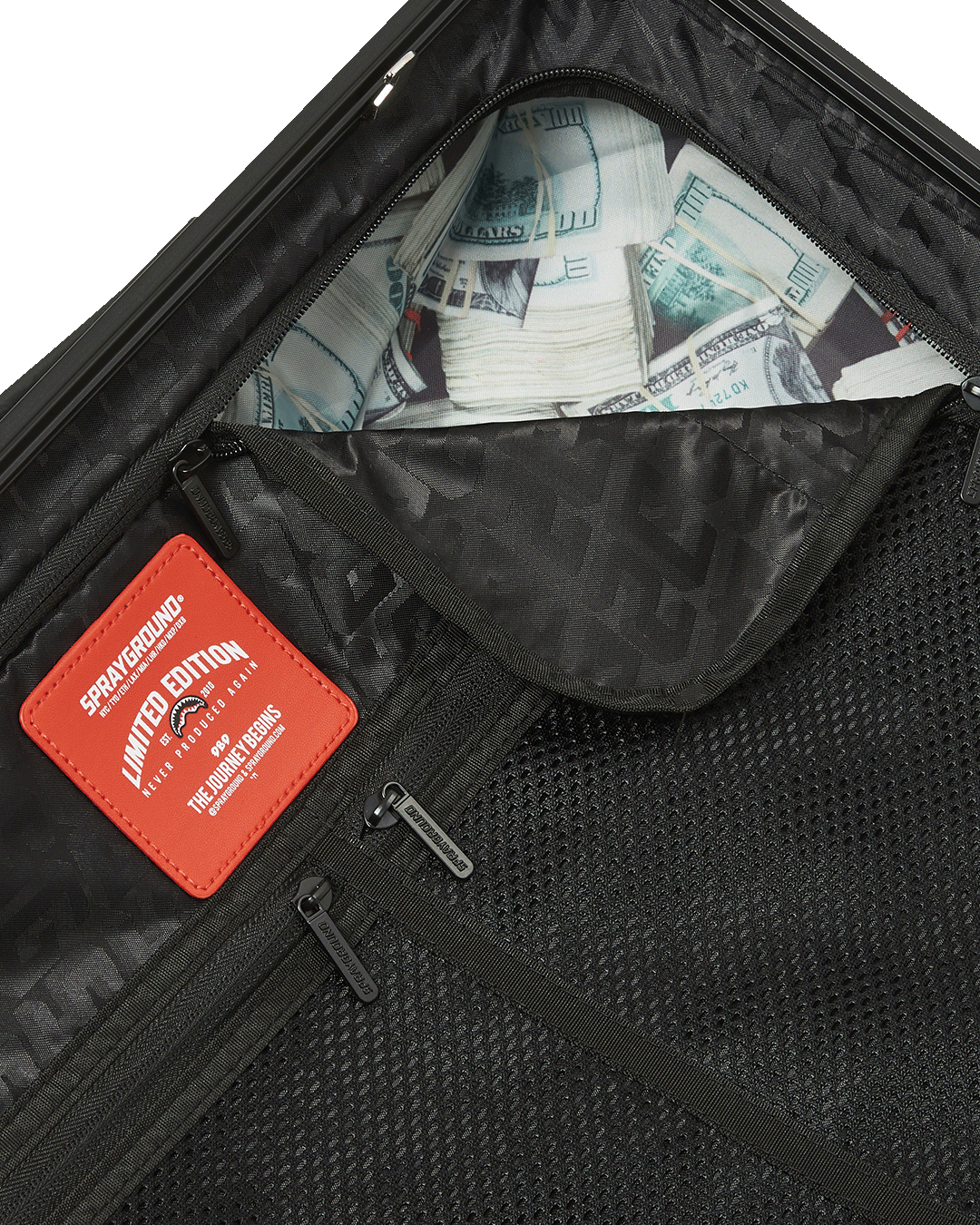 The interior of the hardshell carry-on luggage features multiple pockets and compression straps for maximum organization.