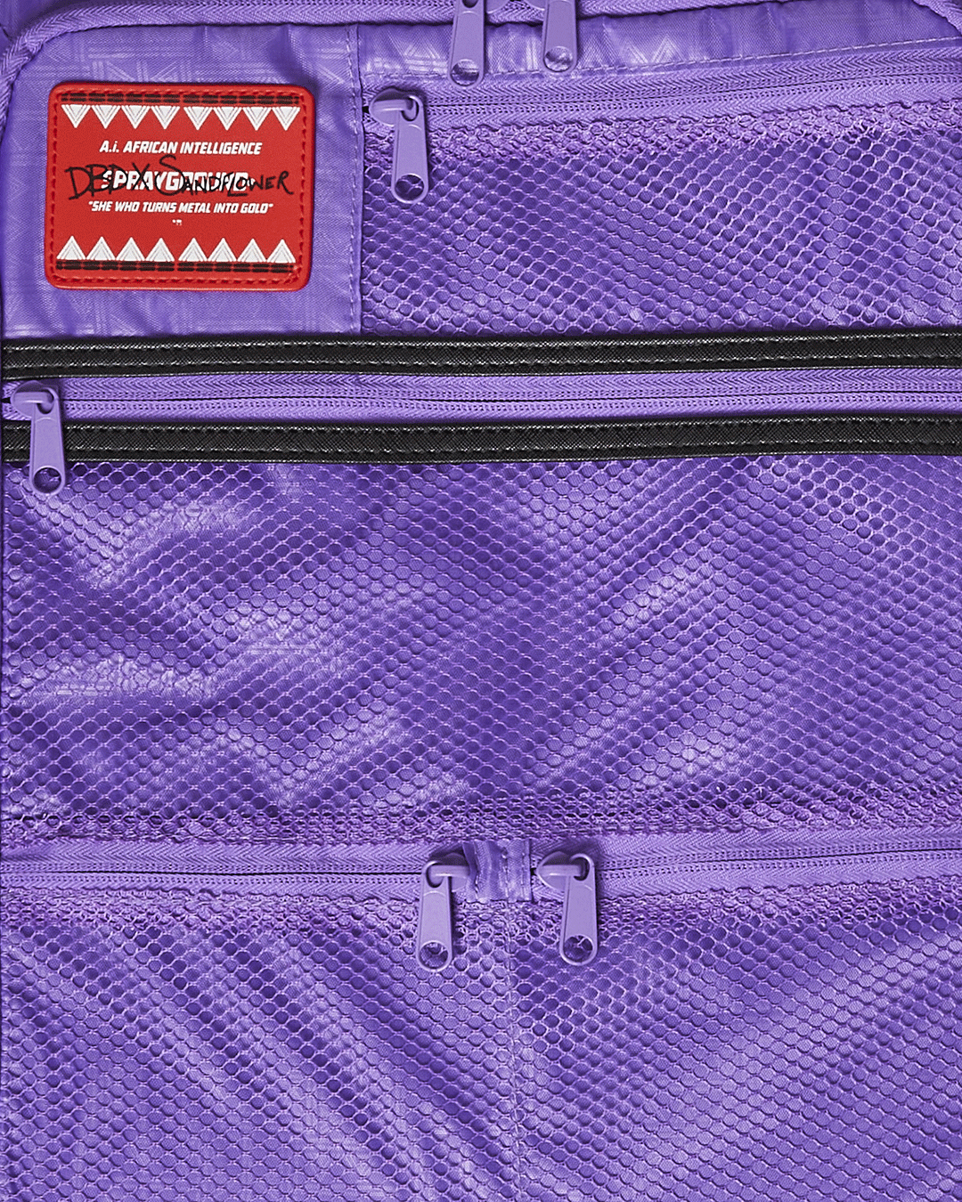 Side profile of hard shell luggage with spinner wheels, placed near a travel backpack