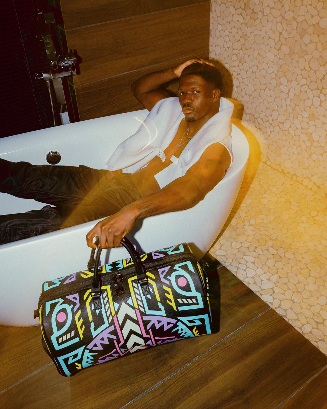 Close-up of the glow in the dark designer duffle bag showcasing the unique abstract design.
