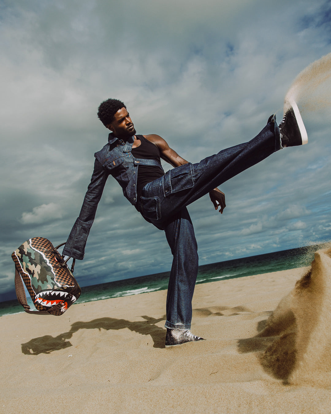 Stylish duffle bag paired with a Louis Vuitton suitcase for luxury travel