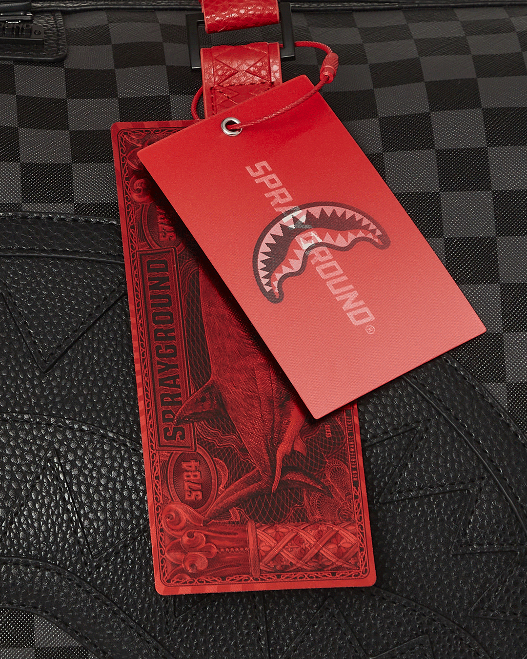 Front view of Monaco Shark Club leather duffle with wheels and handle extended