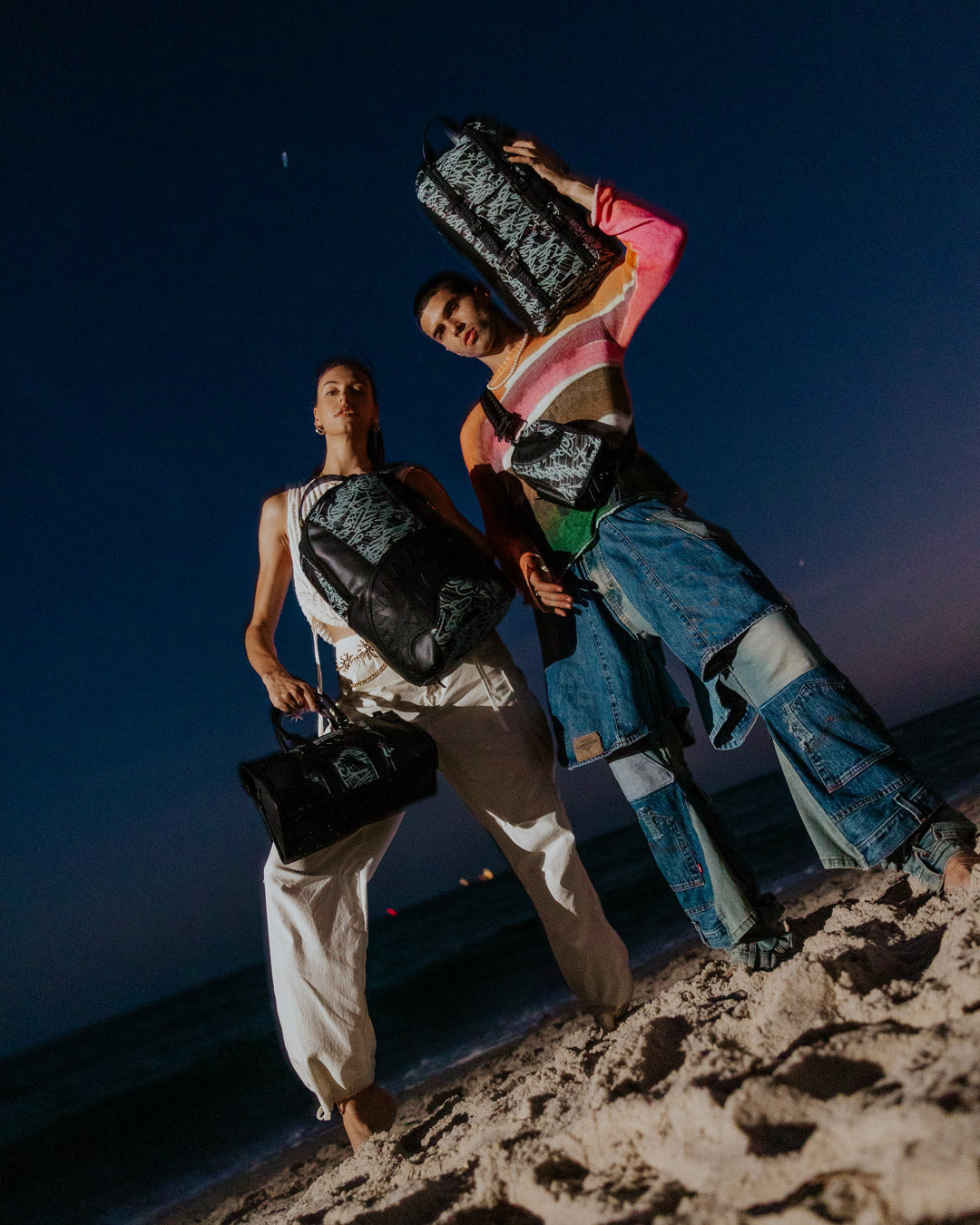 Pyramid mini duffle bag in use with adjustable strap, carried crossbody