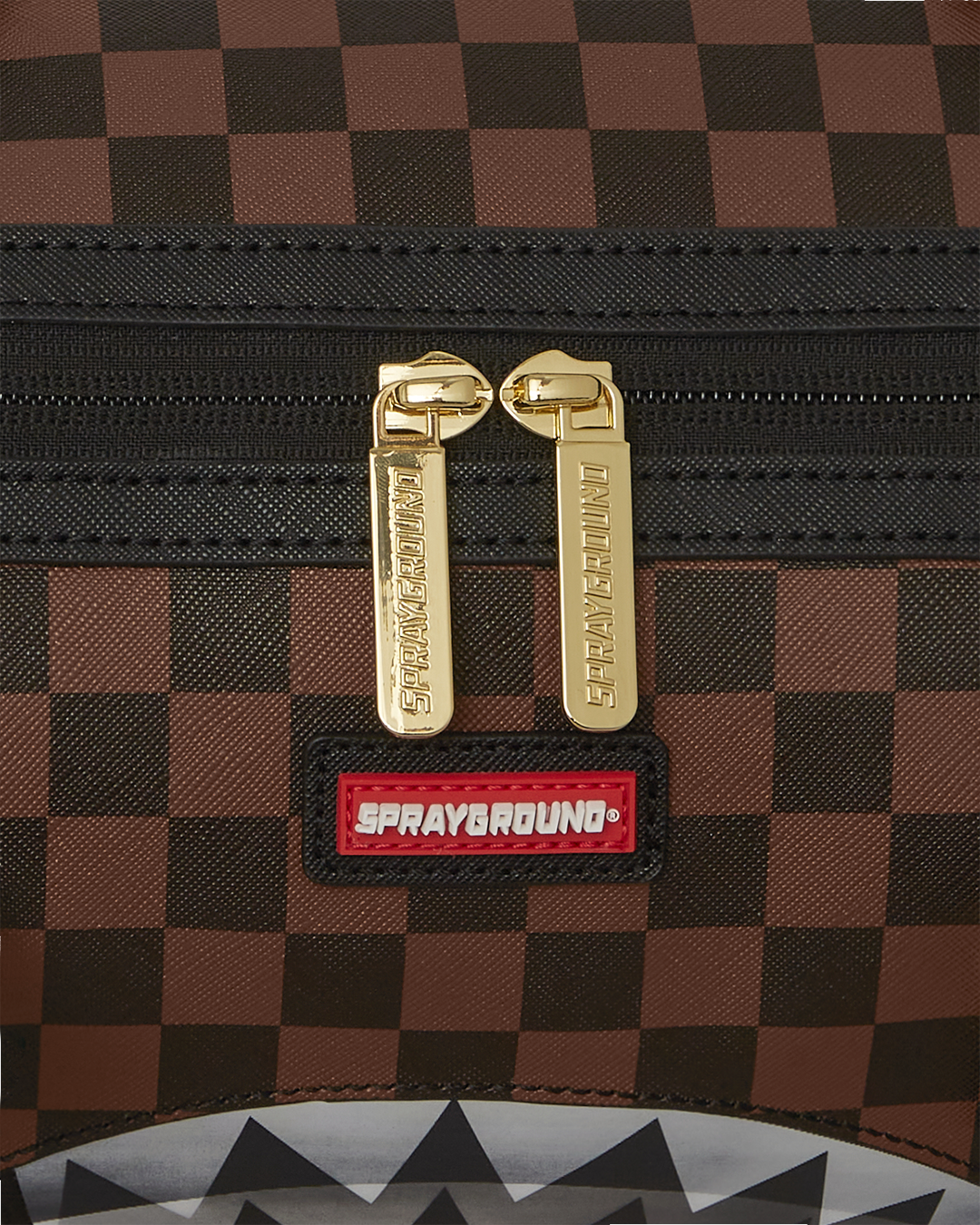 Interior zippered pockets and sneaker compartment of the duffle bag