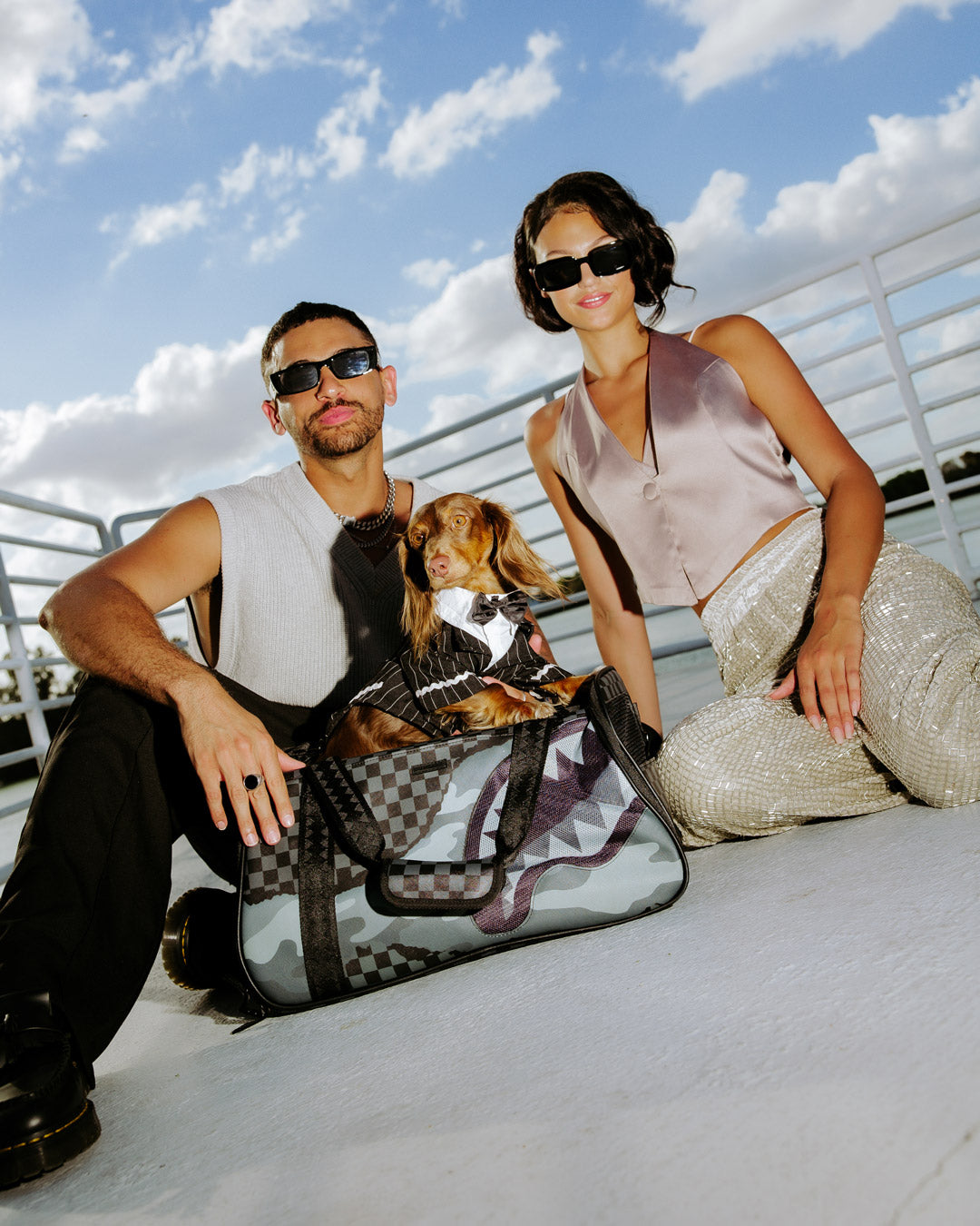 Riptide dog carrier sling with padded shoulder strap for comfort.