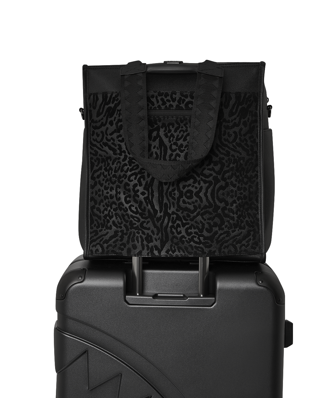 Duffle bag placed on luggage with sleeve attached, ready for travel