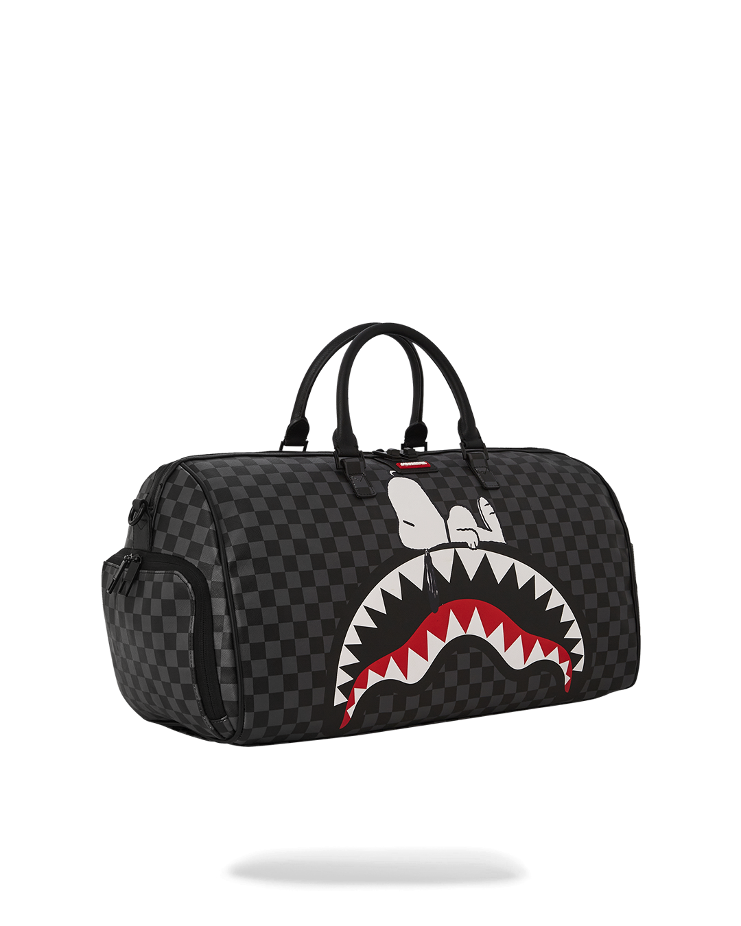 Snoopy duffle bag being carried with adjustable straps, perfect for travel.