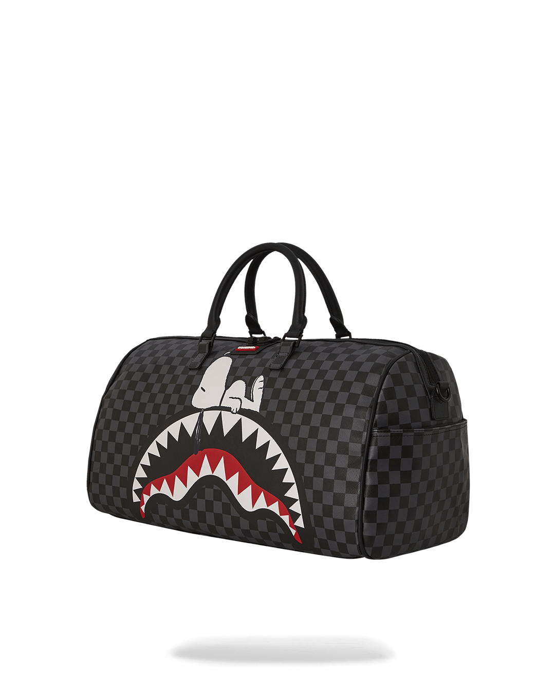 Close-up of the duffle bags gold zippers and water-resistant fabric.
