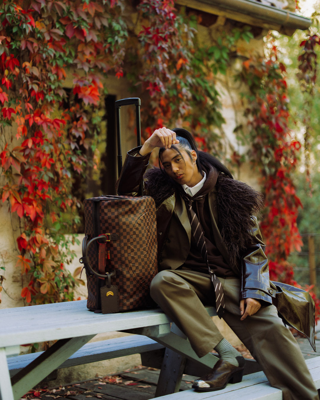 Open view showing the spacious interior of the faux leather duffle bag.