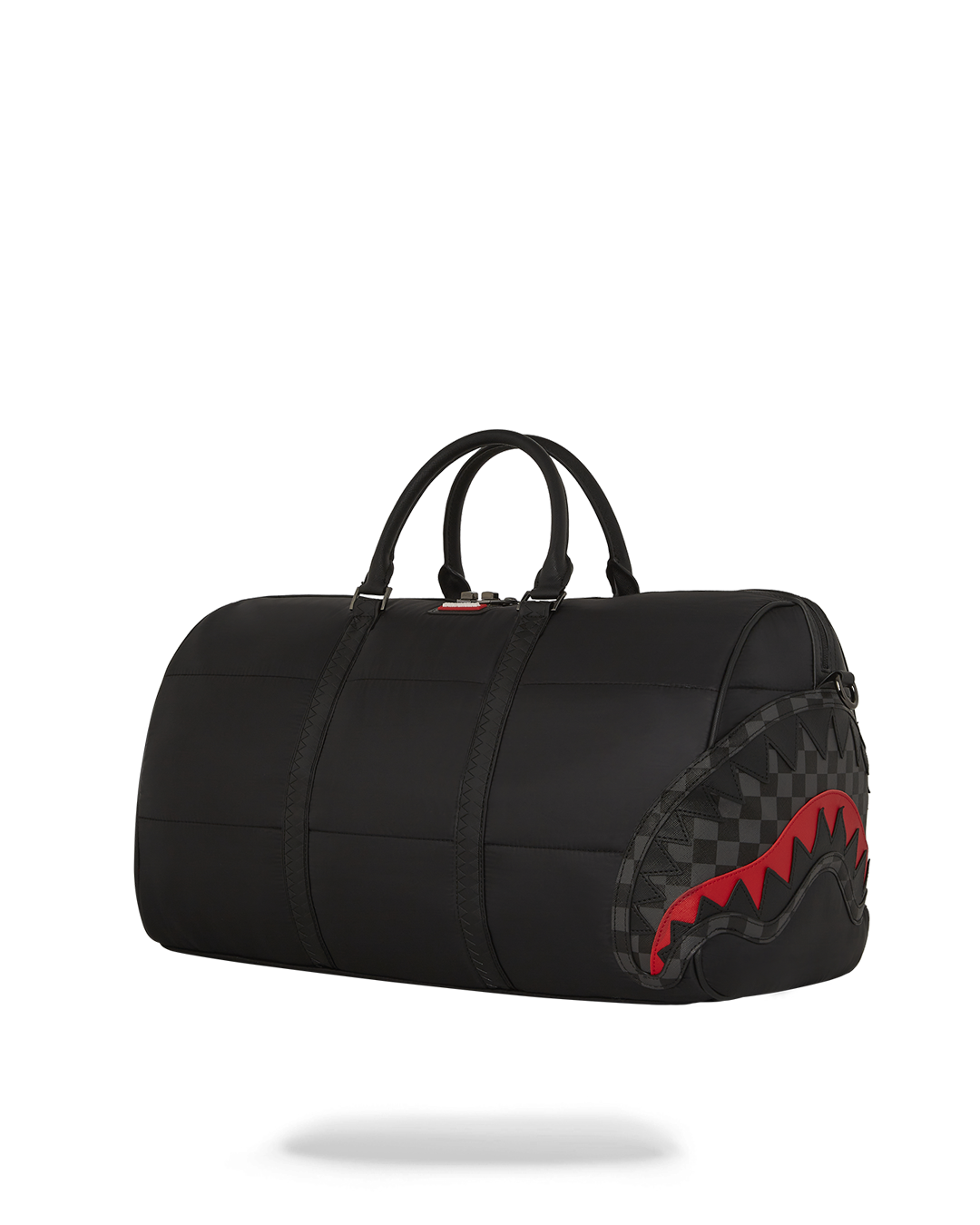 Close-up of the faux leather puffer bag showcasing its gold zippers.