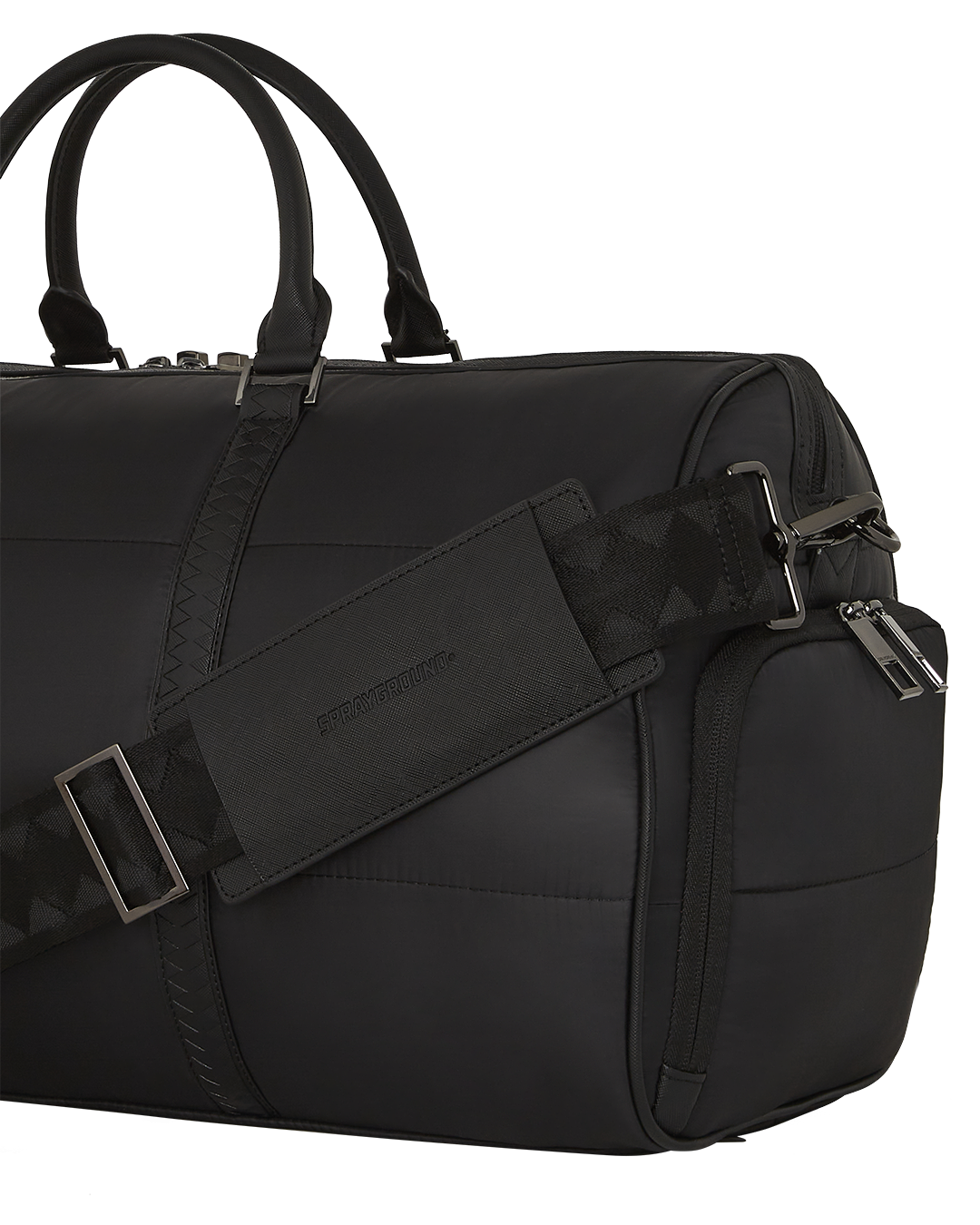 Close-up of the faux leather puffer bag showcasing its gold zippers.