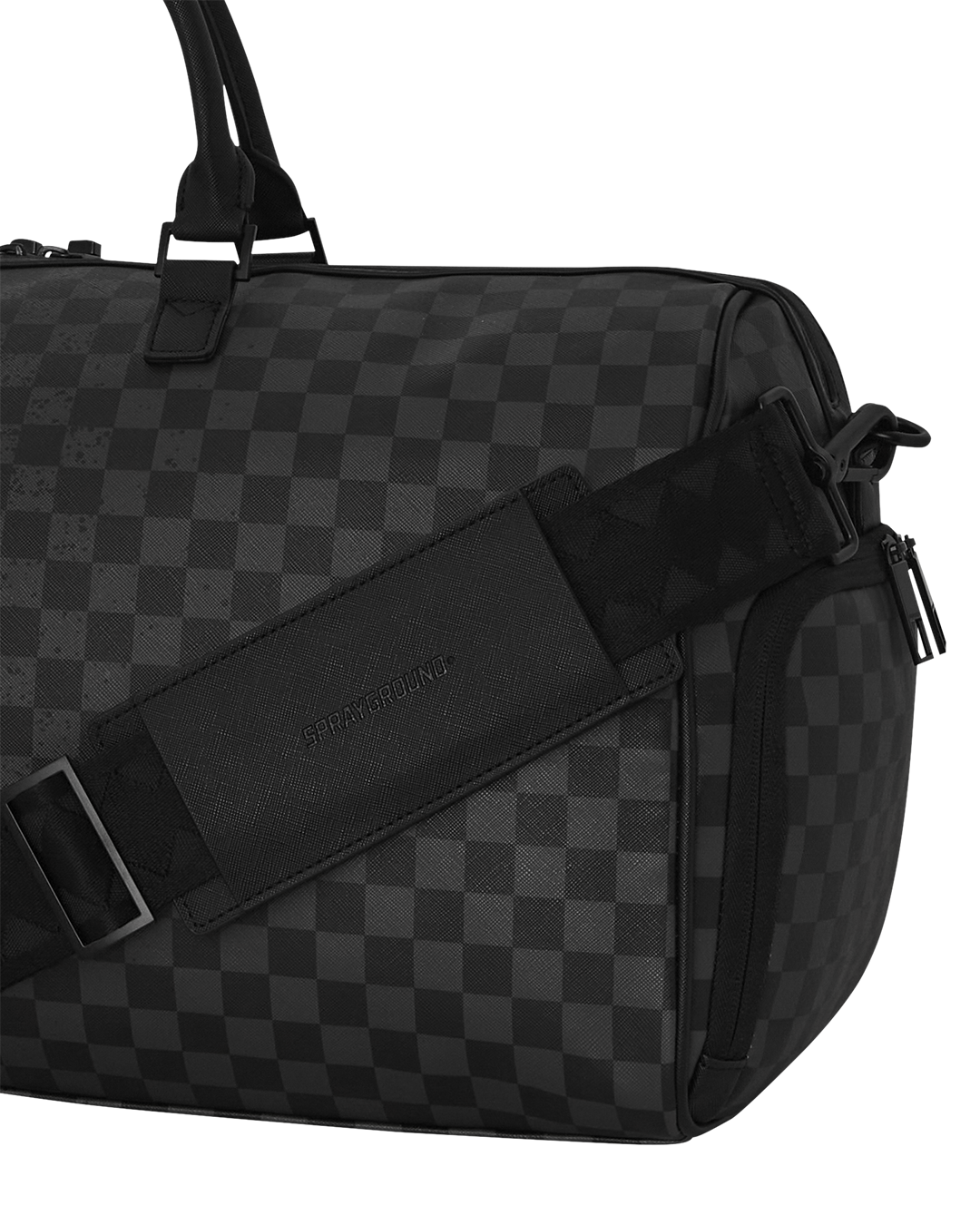 Faux leather duffle bag side view with gold zippers and urban backdrop