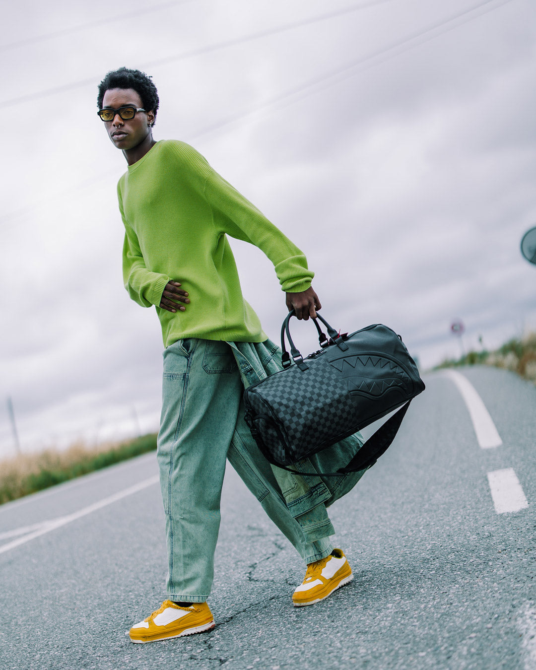 Nightsharks luxury duffle bag open, showcasing interior pockets and sleek design