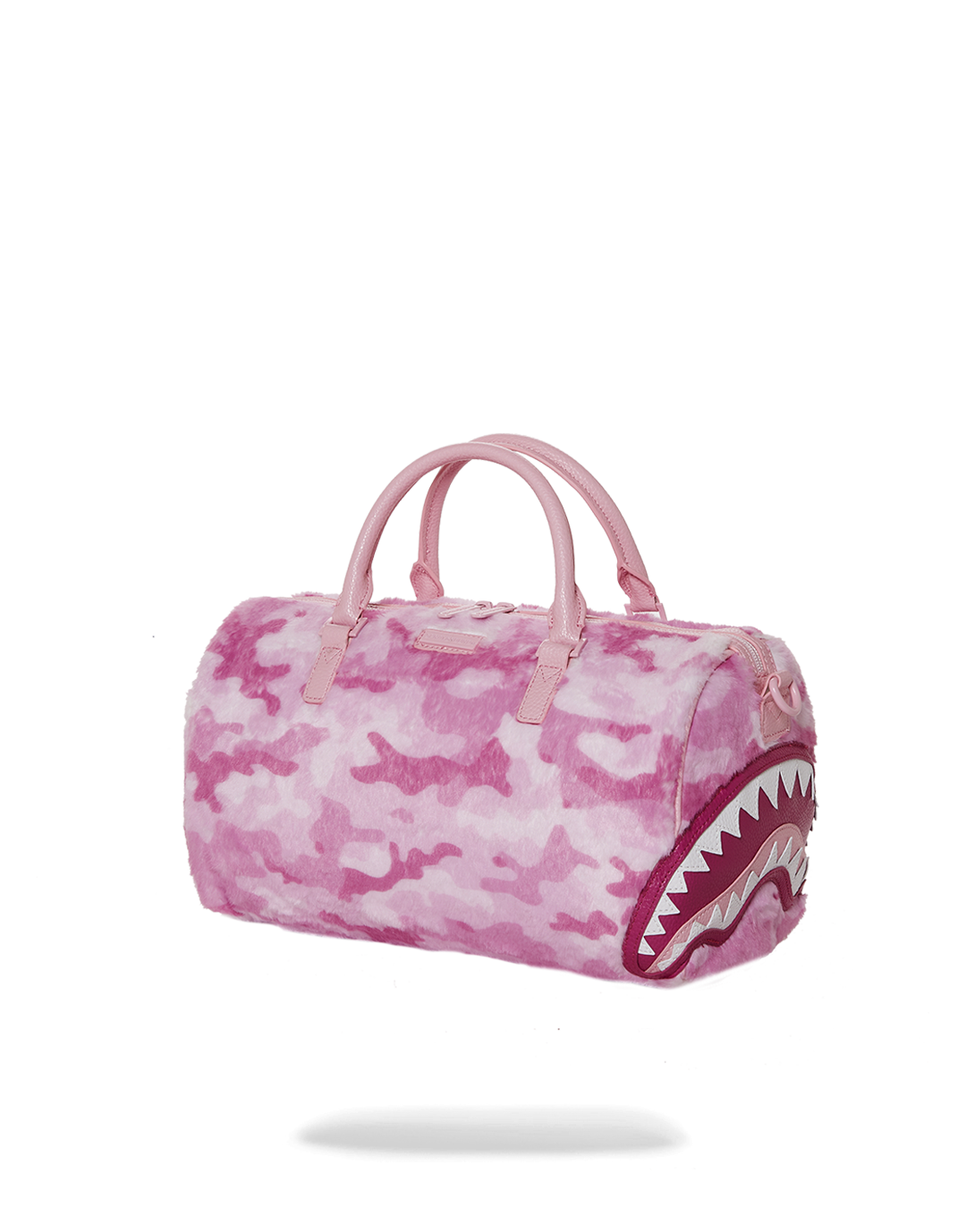 Close-up of faux leather material and water-resistant fabric of the mini duffle