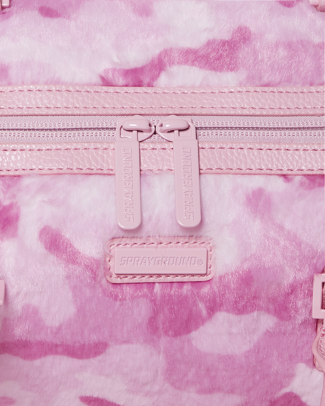 Close-up of faux leather material and water-resistant fabric of the mini duffle