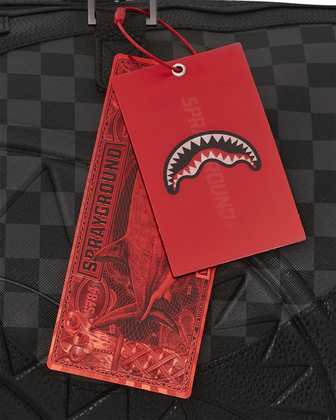 Interior lining detail of designer duffle bags with Sprayground money print