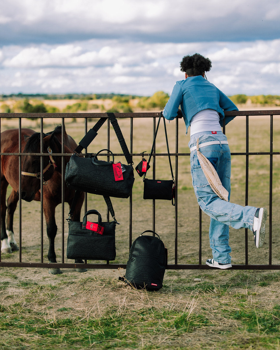 Faux leather duffle bag with a sleek design and adjustable straps, ideal for travel.