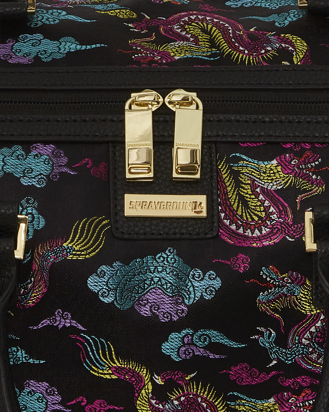 Embroidered dragons travel duffle bag showcasing detailed design.