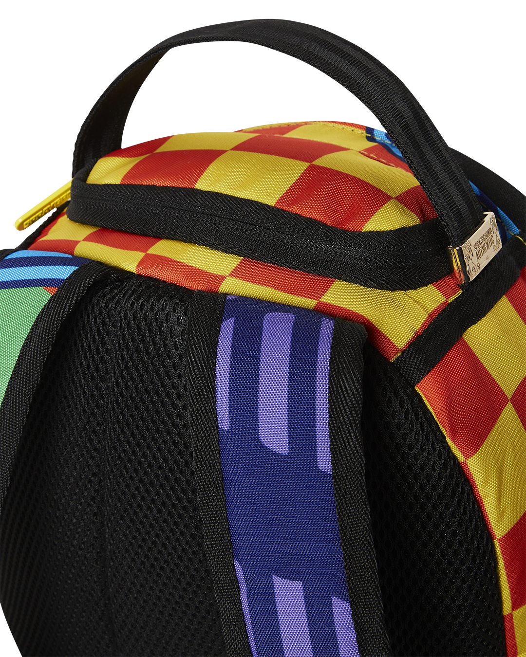 Close-up of the mini backpacks front zipper pocket and velour sunglass compartment