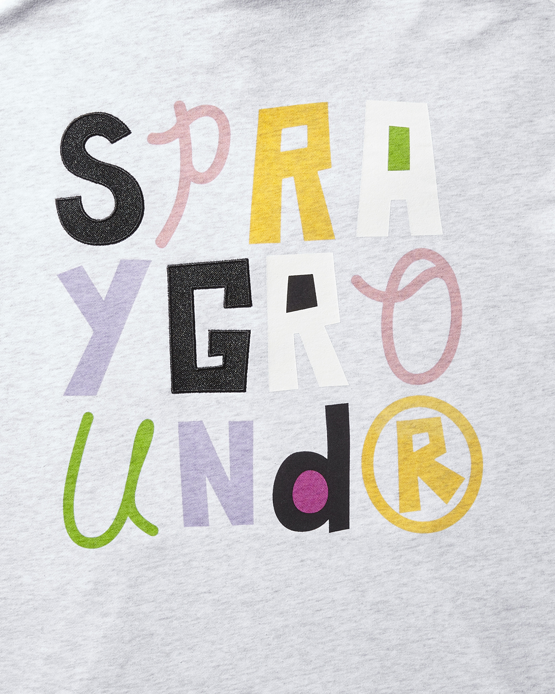 Front view of light grey SpongeBob hoodie with chenille Sprayground patch and kangaroo pocket