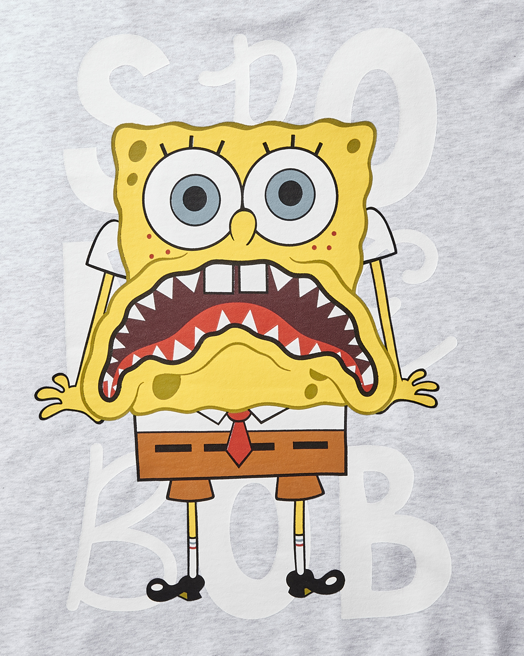 Front view of the light grey crew neck sweatshirt with splat print design