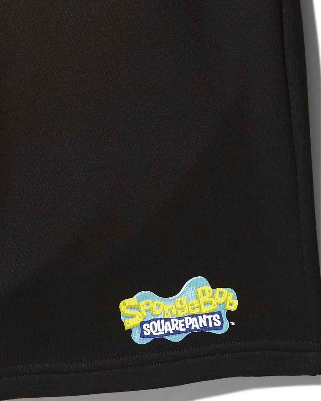 Back view showing the SpongeBob logo on black knit shorts.