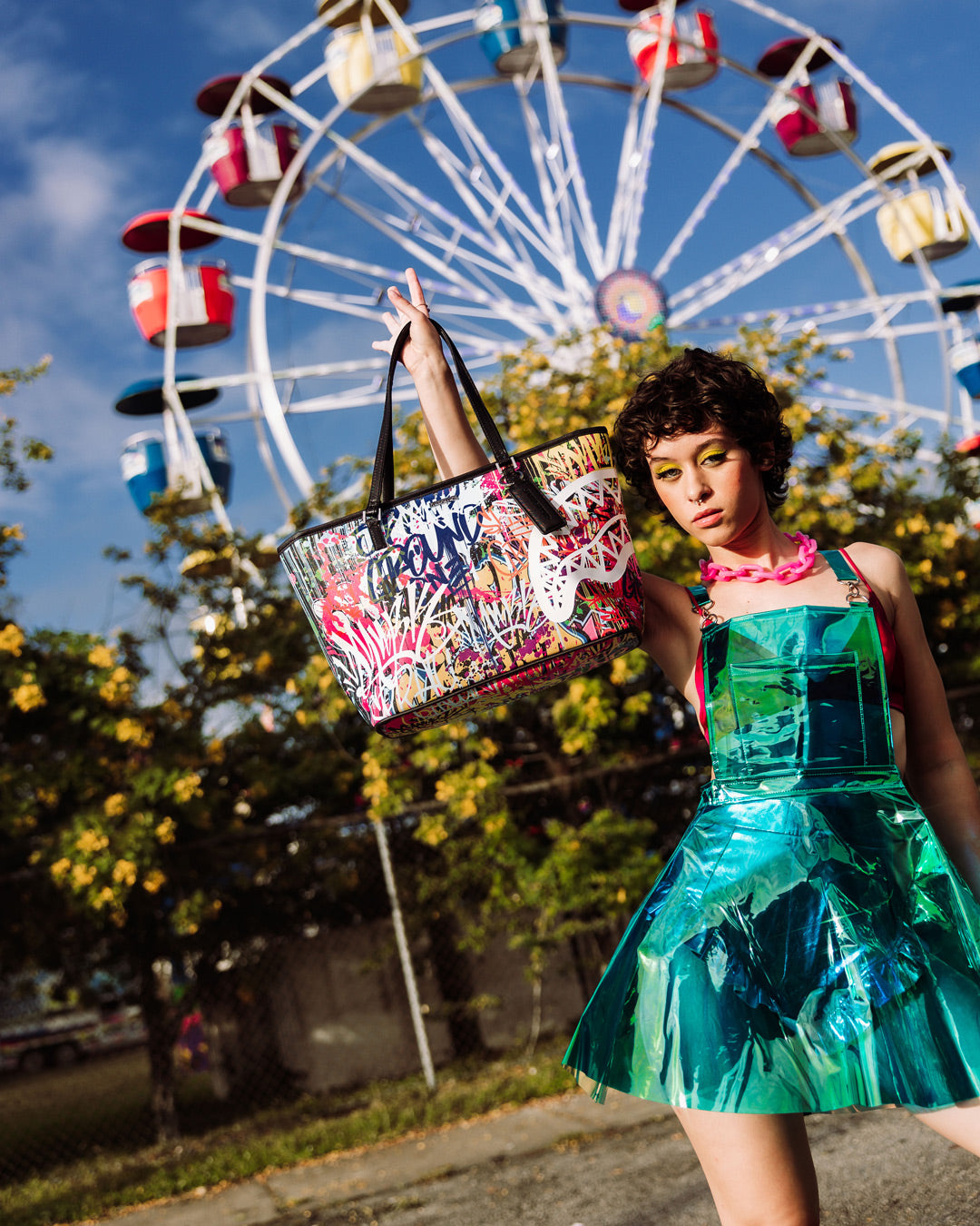 Front view of the vibrant Sprayground tote with animal print design.